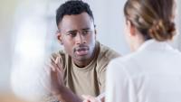 Man talking to doctor